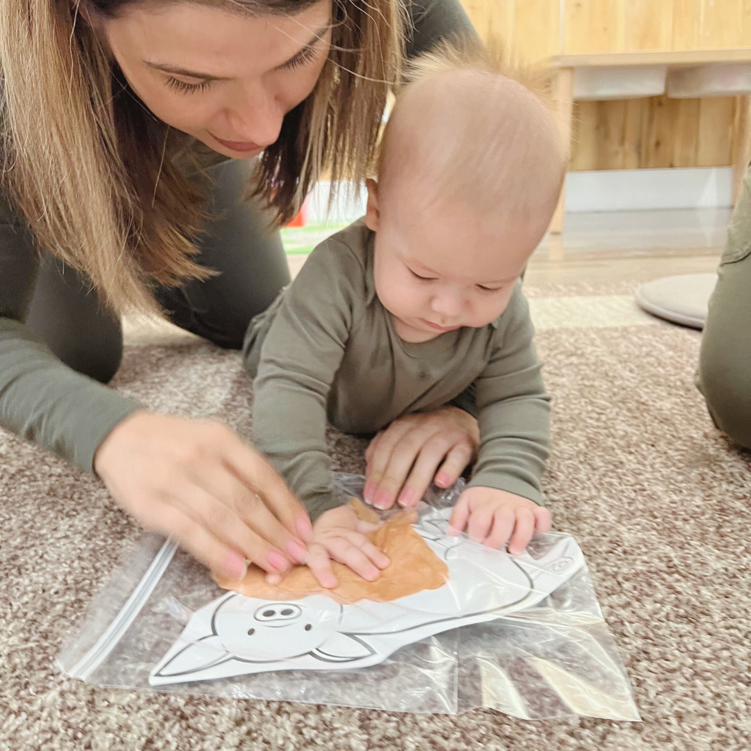 Baby and Mom painting a picture together